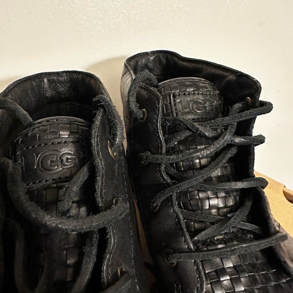 Men’s black leather UGG boots.